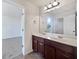 Bathroom with double vanity and view of bedroom at 8372 Members Dr, Jonesboro, GA 30236