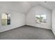 Bright bedroom featuring grey carpet and two windows at 8372 Members Dr, Jonesboro, GA 30236