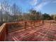 Large deck with wooden railings and scenic views at 8372 Members Dr, Jonesboro, GA 30236