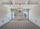 Formal dining room featuring a chandelier and carpet flooring at 8372 Members Dr, Jonesboro, GA 30236