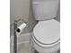 Bathroom with toilet and freestanding toilet paper holder at 896 Farmstead Rd # 162, Suwanee, GA 30024