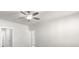 Bright hallway with ceiling fan and doors to other rooms at 896 Farmstead Rd, Suwanee, GA 30024