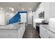 Modern kitchen with white cabinets, granite countertops, and stainless steel appliances at 896 Farmstead Rd, Suwanee, GA 30024