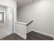 Modern staircase with dark wood flooring and white walls at 896 Farmstead Rd # 162, Suwanee, GA 30024