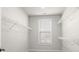 Large walk-in closet with wire shelving and window at 896 Farmstead Rd # 162, Suwanee, GA 30024