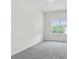 Bright bedroom with gray carpet and window at 307 Skye Ln # 46, Cartersville, GA 30121