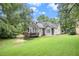 House backyard view with deck and green lawn at 110 Golf Terrace Dr, Stockbridge, GA 30281