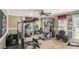 Home gym with various equipment and flooring at 110 Golf Terrace Dr, Stockbridge, GA 30281