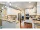 Modern kitchen with white cabinets and granite countertops at 110 Golf Terrace Dr, Stockbridge, GA 30281