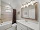 Clean bathroom with a shower/tub combo and modern vanity at 191 Foxtail Rd, Woodstock, GA 30188