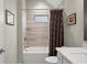 Updated bathroom, featuring a tub, shower, and vanity at 191 Foxtail Rd, Woodstock, GA 30188