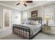 Main bedroom with a king-size bed and private bathroom at 191 Foxtail Rd, Woodstock, GA 30188