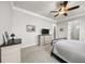 Main bedroom with dresser, TV, and ceiling fan at 191 Foxtail Rd, Woodstock, GA 30188