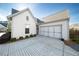 Two-car garage with paver driveway and landscaping at 191 Foxtail Rd, Woodstock, GA 30188