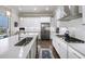 Bright kitchen with stainless steel appliances and white cabinets at 191 Foxtail Rd, Woodstock, GA 30188