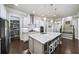 Spacious kitchen with island, stainless steel appliances, and ample cabinet storage at 191 Foxtail Rd, Woodstock, GA 30188