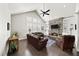 Spacious living room with stone fireplace, built-in shelving, and hardwood floors at 191 Foxtail Rd, Woodstock, GA 30188