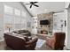 Living room with hardwood floors, a fireplace, and comfortable seating at 191 Foxtail Rd, Woodstock, GA 30188