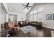 Living room with hardwood floors, a fireplace, and comfortable seating at 191 Foxtail Rd, Woodstock, GA 30188