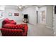 Spacious loft sitting area with red couch and TV at 191 Foxtail Rd, Woodstock, GA 30188