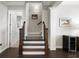 Elegant staircase with dark wood treads and iron balusters at 191 Foxtail Rd, Woodstock, GA 30188