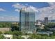 High-rise building with pool and tennis court, surrounded by lush greenery at 2795 Peachtree Rd # 1305, Atlanta, GA 30305