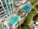 Aerial view of the building showing a swimming pool and tennis courts at 2795 Peachtree Rd # 1305, Atlanta, GA 30305