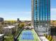 Beautiful aerial view of the community, featuring a tennis court and towering architecture at 2795 Peachtree Rd # 1305, Atlanta, GA 30305
