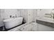 Luxury bathroom with freestanding soaking tub and marble tile at 2795 Peachtree Rd # 1305, Atlanta, GA 30305