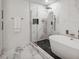 Spa-like bathroom with a large walk-in shower and a soaking tub at 2795 Peachtree Rd # 1305, Atlanta, GA 30305