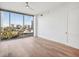 Hardwood floor bedroom with large window and city view at 2795 Peachtree Rd # 1305, Atlanta, GA 30305