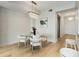 Dining area featuring modern chandelier and white chairs at 2795 Peachtree Rd # 1305, Atlanta, GA 30305