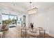 Modern dining area with glass table and comfortable chairs at 2795 Peachtree Rd # 1305, Atlanta, GA 30305