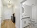 Light-filled entryway with hardwood floors, stylish console table, and modern chandelier at 2795 Peachtree Rd # 1305, Atlanta, GA 30305