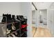 Hallway view of a shoe rack and closet leading to a luxurious bathroom at 2795 Peachtree Rd # 1305, Atlanta, GA 30305