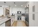 Modern kitchen featuring stainless steel appliances, marble countertops, and modern fixtures at 2795 Peachtree Rd # 1305, Atlanta, GA 30305