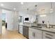 A modern kitchen is designed with bright white cabinets and stainless steel appliances at 2795 Peachtree Rd # 1305, Atlanta, GA 30305