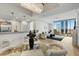 Bright living area featuring floor-to-ceiling windows with city views and modern decor and chandelier at 2795 Peachtree Rd # 1305, Atlanta, GA 30305