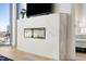 Living room with white fireplace and flatscreen TV with bright sunny views from the large windows at 2795 Peachtree Rd # 1305, Atlanta, GA 30305