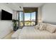 Light-filled main bedroom offers city views from a sliding glass door and a comfortable aesthetic at 2795 Peachtree Rd # 1305, Atlanta, GA 30305