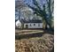 House backyard with lots of trees and leaves at 708 South Ave, Forest Park, GA 30297