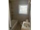 Bathroom with white bathtub and sink at 708 South Ave, Forest Park, GA 30297