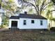 Back of house with sliding glass door and small deck at 708 South Ave, Forest Park, GA 30297