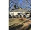 Charming ranch home with a classic facade and mature trees at 708 South Ave, Forest Park, GA 30297