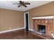 Living room with hardwood floors and fireplace at 708 South Ave, Forest Park, GA 30297