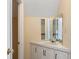 Small bathroom with corner vanity and mirrored medicine cabinets at 120 Paces Lakes Pt, Dallas, GA 30157