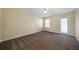 Bedroom with carpet, window, and exterior access at 120 Paces Lakes Pt, Dallas, GA 30157