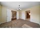 Dining room with chandelier and carpet flooring at 120 Paces Lakes Pt, Dallas, GA 30157