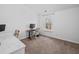 Bright bedroom with a desk and carpeted floor at 1227 Clear Stream Rdg, Auburn, GA 30011