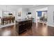 Kitchen island with granite countertop, dark wood cabinets, and seating for two at 1227 Clear Stream Rdg, Auburn, GA 30011